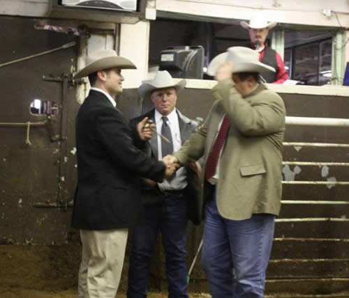 Lynn Langvardt accepts the Livestock Championship for 2010.